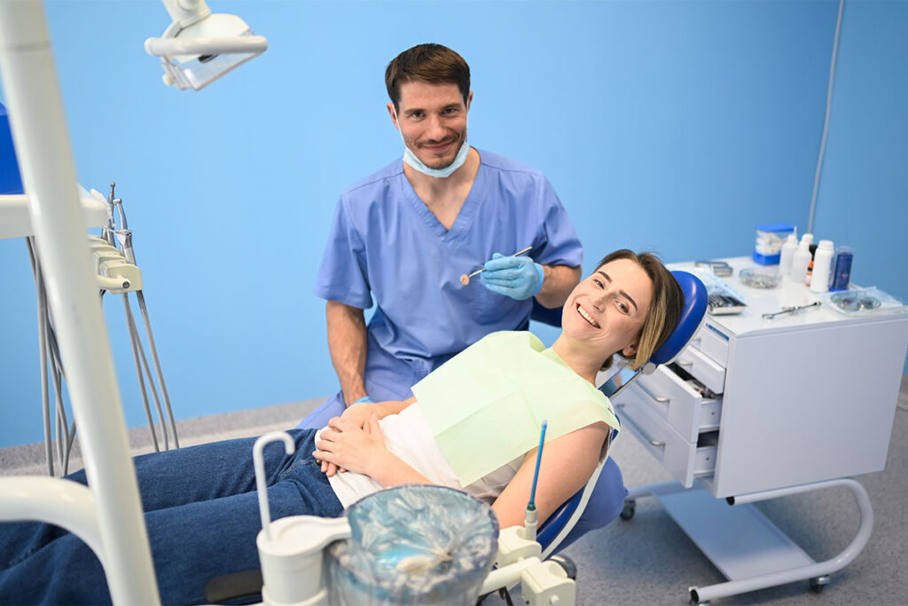 Dentist helping a child during their first dental visit